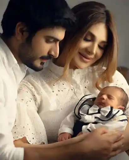 Proud parents standing together