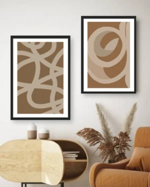 Modern earth tone abstract line art frame set of 2 in beige and brown, displayed in black frames above a living room cabinet